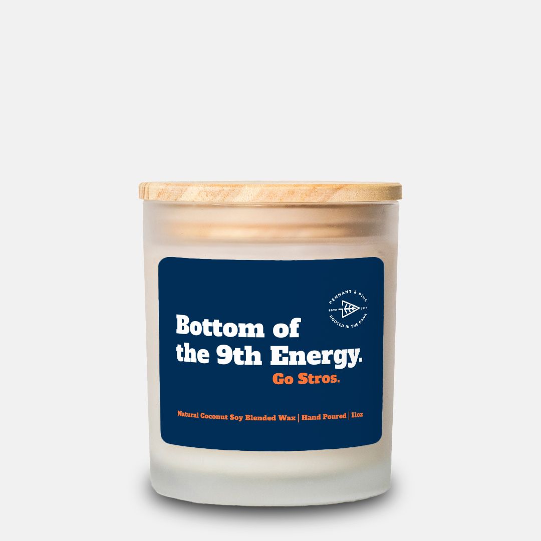 Candle with a blue label and wooden lid on a white background