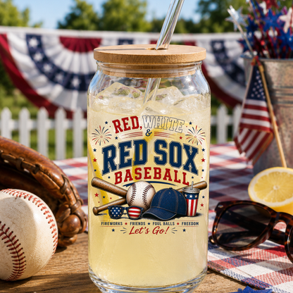 Glass jar with a straw, labeled 'Red, White & Red Sox Baseball', on a table with baseball-themed decor.