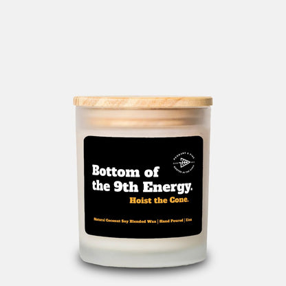 Candle with a wooden lid and black label on a white background