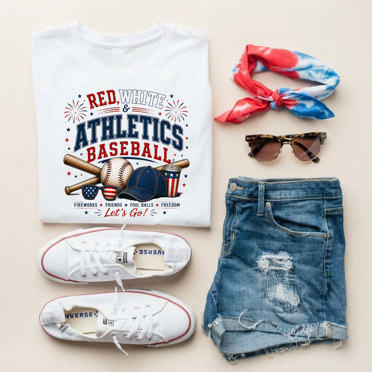 Baseball-themed t-shirt with accessories including shorts, sneakers, sunglasses, and a headband on a light background.