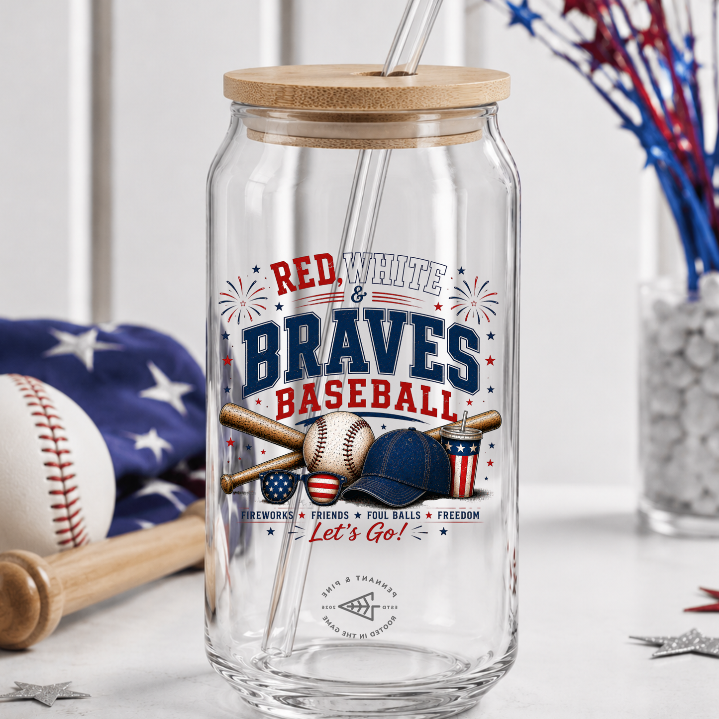 Clear glass tumbler with wooden lid and straw, featuring 'Red White & Braves Baseball' design.