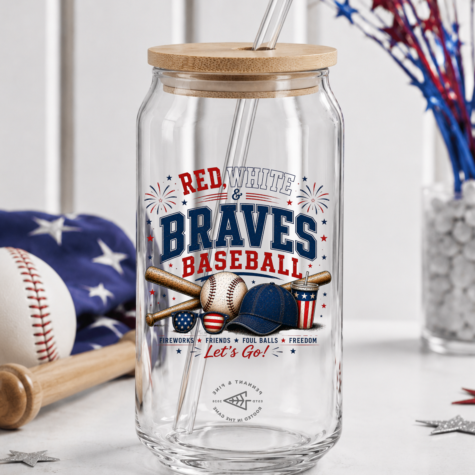 Clear glass tumbler with wooden lid and straw, featuring 'Red White & Braves Baseball' design.