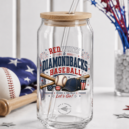 Clear glass tumbler with wooden lid and baseball-themed design on a white surface.