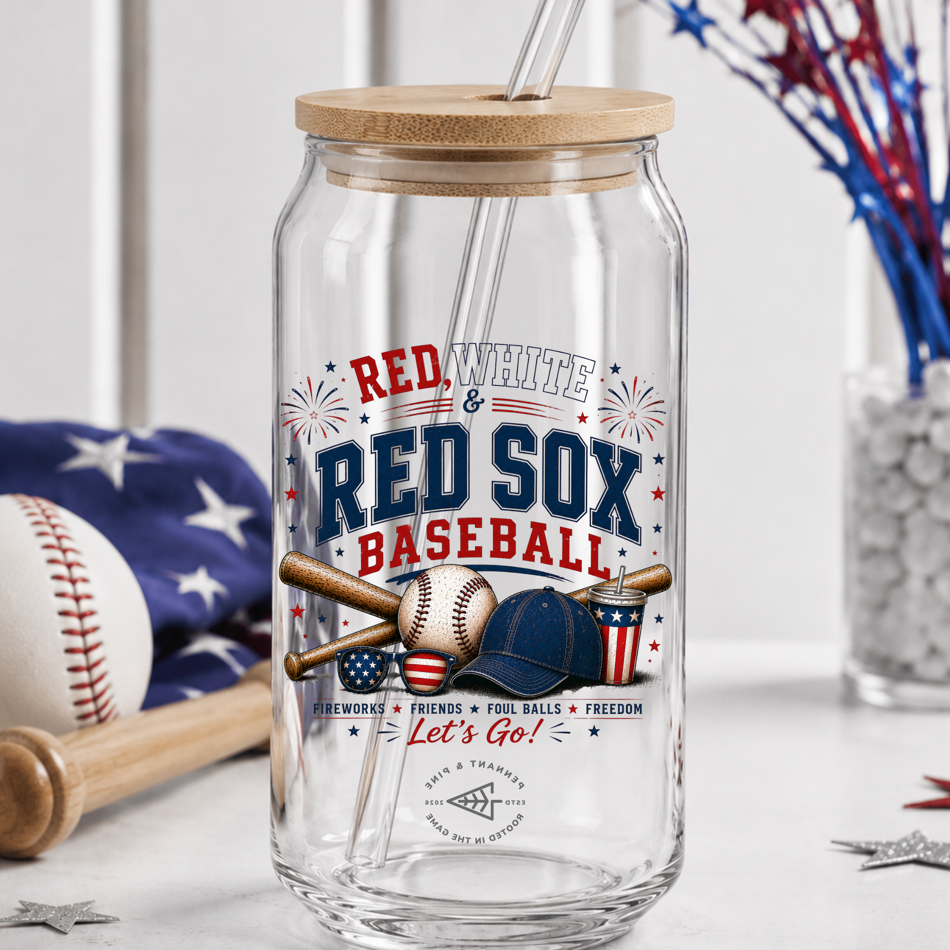 Clear glass tumbler with wooden lid featuring Red Sox baseball-themed design on a white surface.