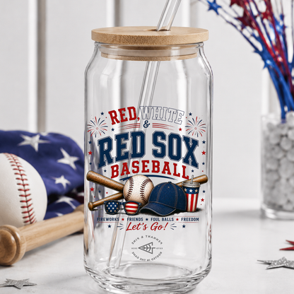 Clear glass tumbler with wooden lid featuring Red Sox baseball-themed design on a white surface.