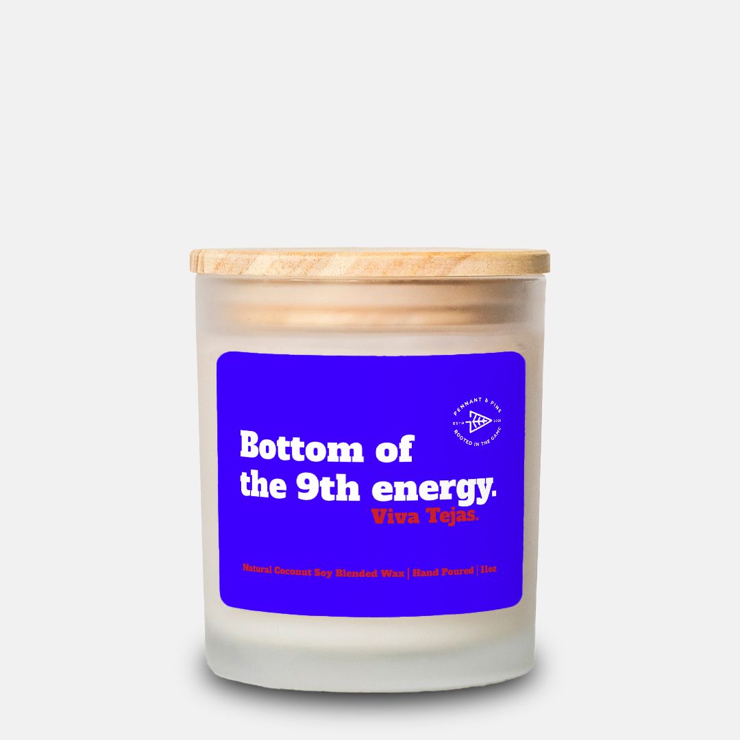 Candle with a blue label and wooden lid on a white background