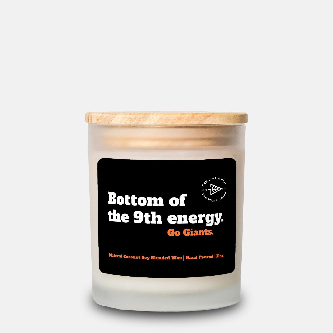Candle with a wooden lid and black label on a white background
