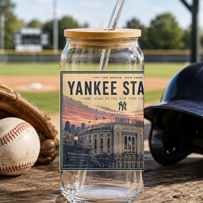 Glass jar with wooden lid featuring a Yankees Stadium label, surrounded by baseball equipment on a field.
