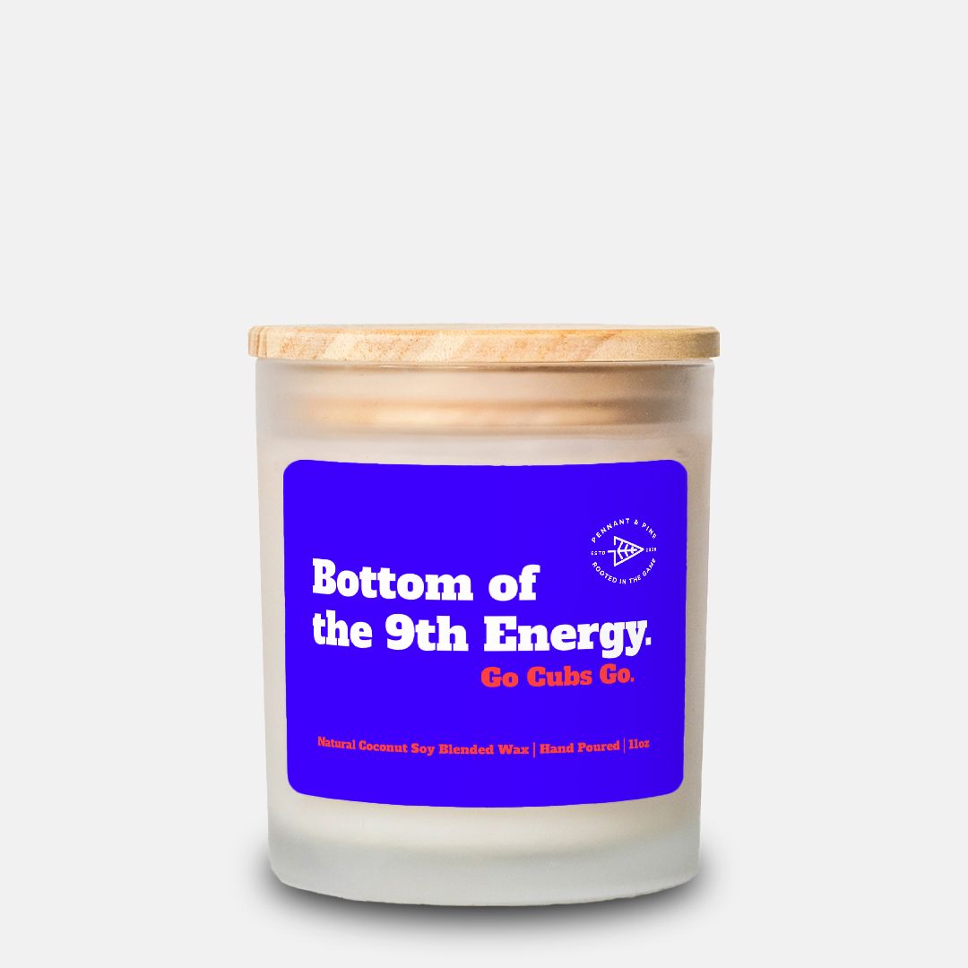Candle with a blue label and wooden lid on a white background