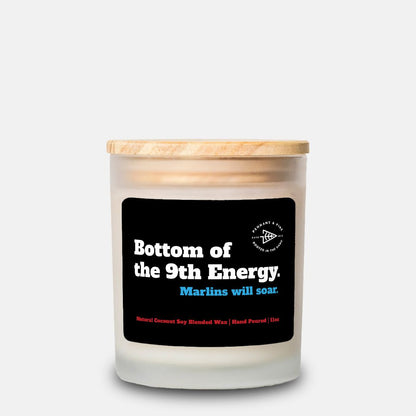 Candle with a wooden lid and black label on a white background