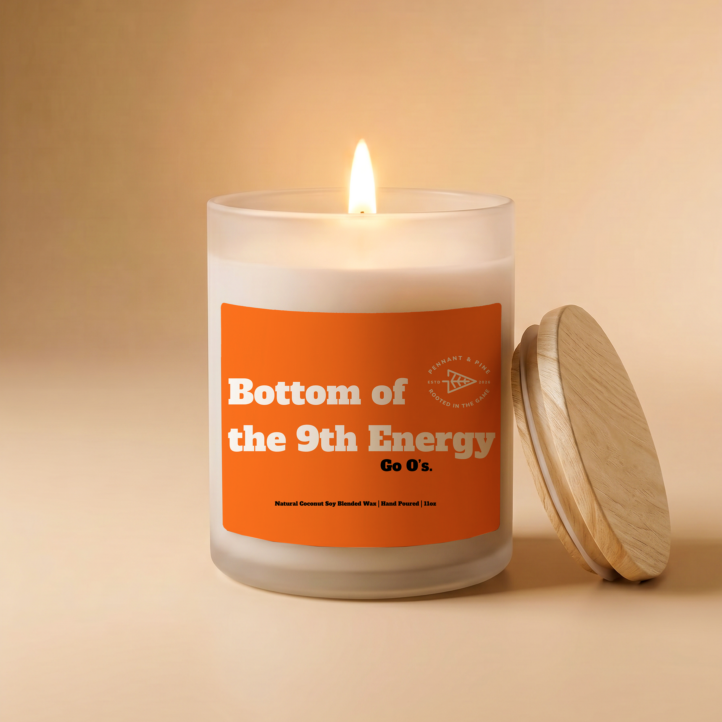Candle with an orange label on a beige background
