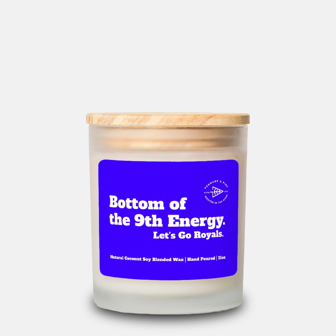 Candle with a blue label and wooden lid on a white background