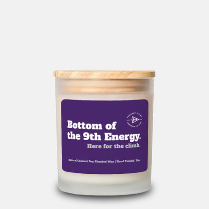 Candle with a purple label on a white background