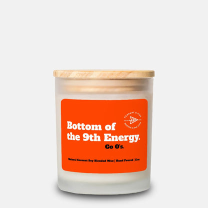 Candle with an orange label on a white background