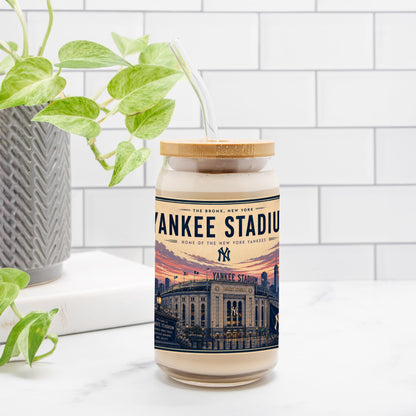 Candle with Yankee Stadium label on a white surface with a plant in the background