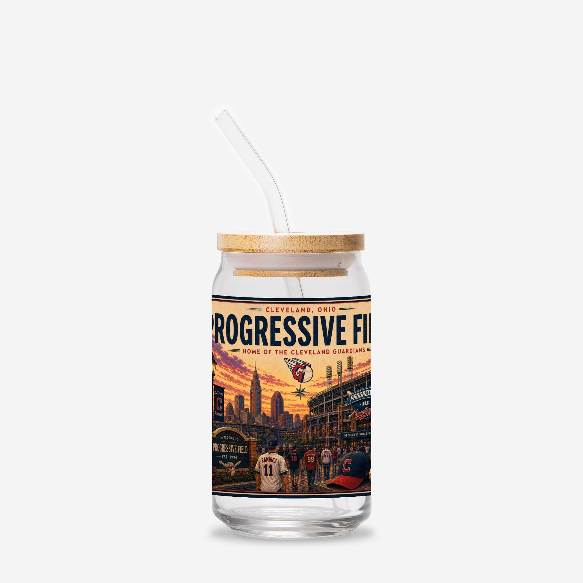 Glass tumbler with straw featuring a sports-themed design on a white background