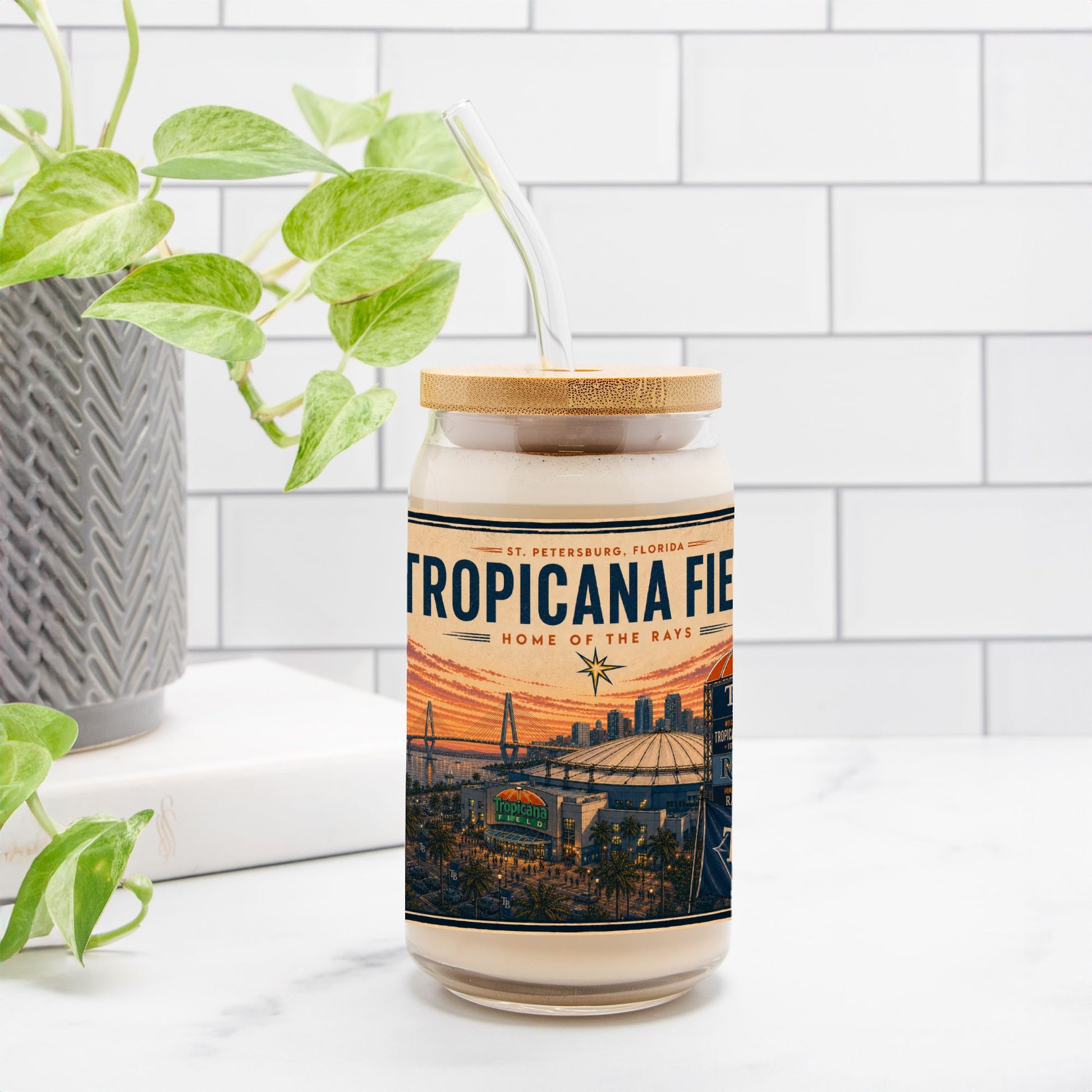 Tumbler with Tropicana Field design on a white surface with a plant in the background