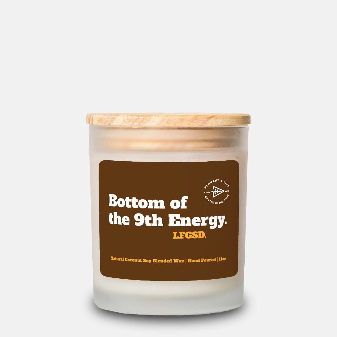 Candle with a brown label on a white background