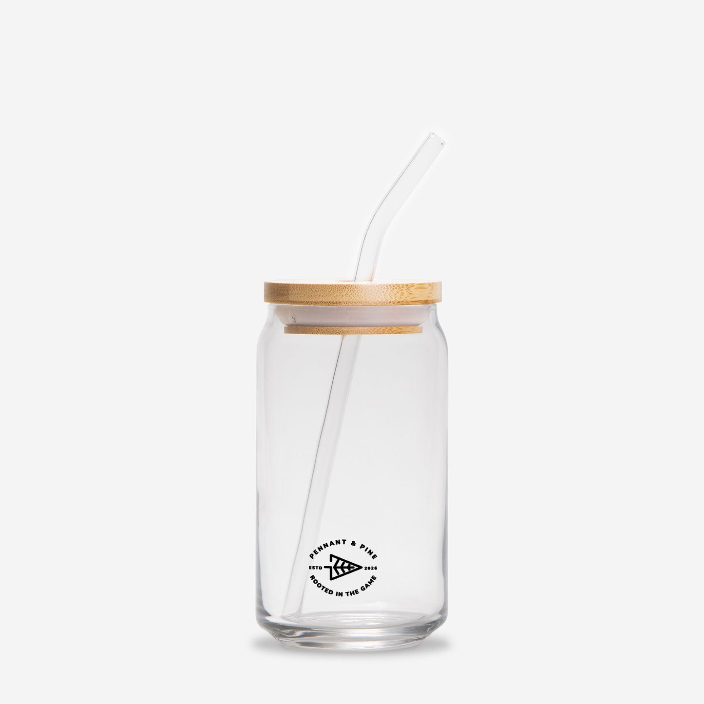 Clear glass jar with wooden lid and straw on a white background