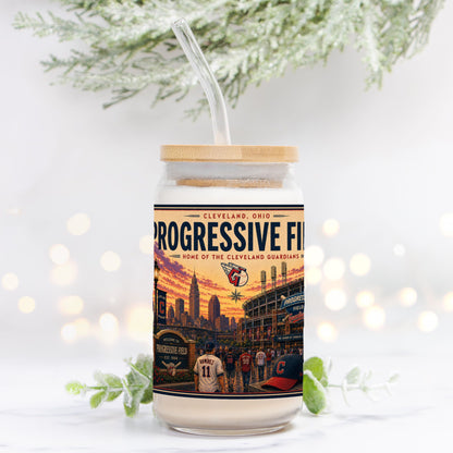 Tumbler with a design of Progressive Field and Cleveland Guardians branding on a white background with blurred lights and greenery.